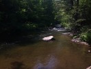 Peeking upstream from one of the boulders