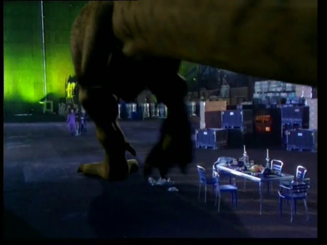 The crew running away from the t-rex